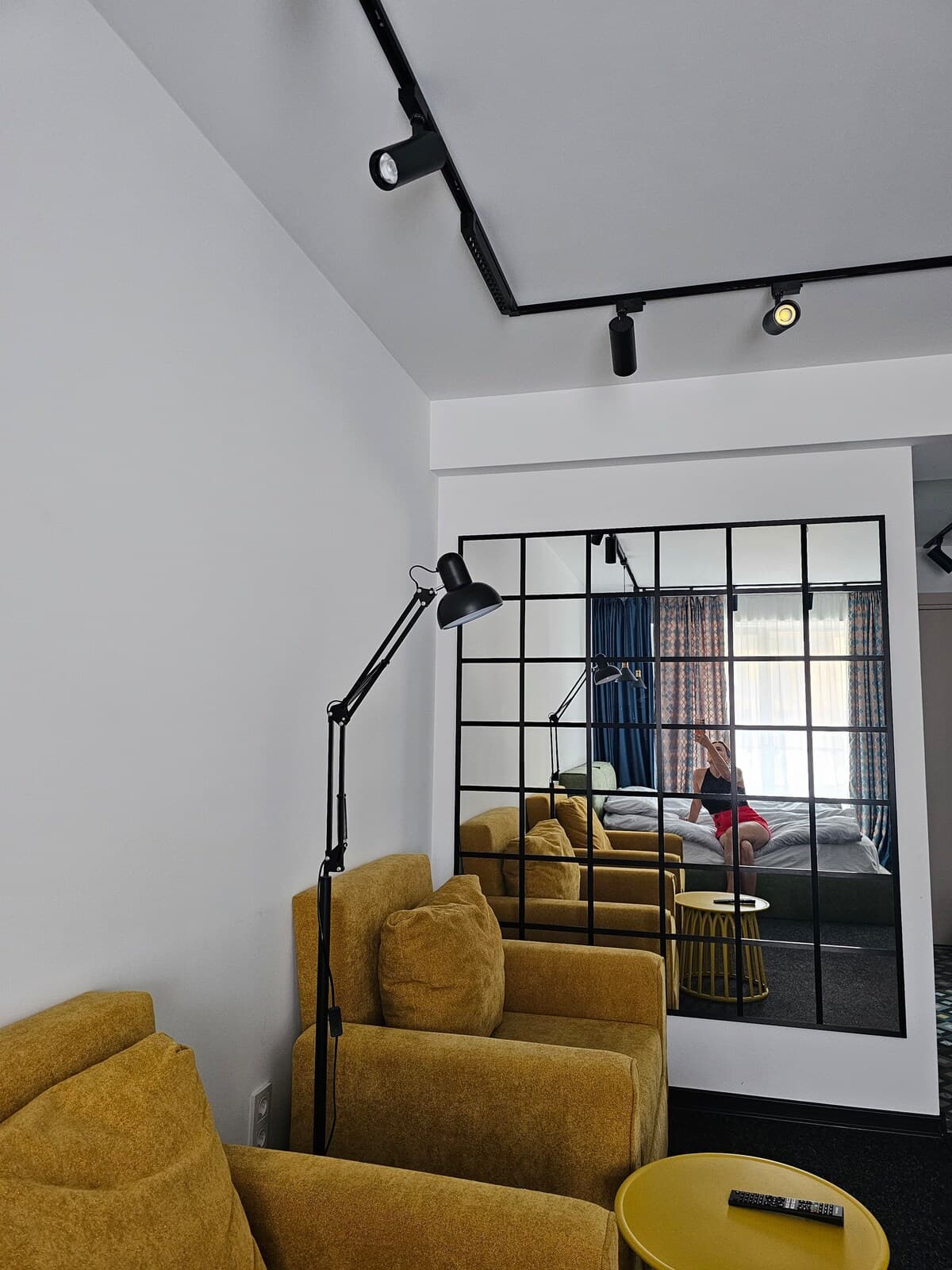 Living room with mirror and reading lamp