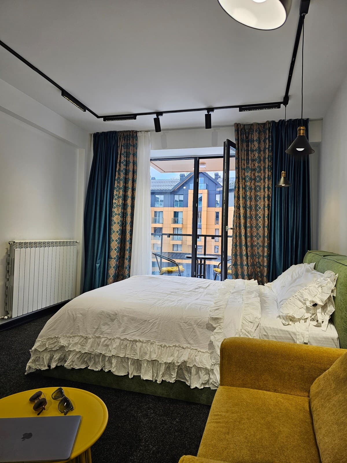 Bedroom with natural light and balcony access
