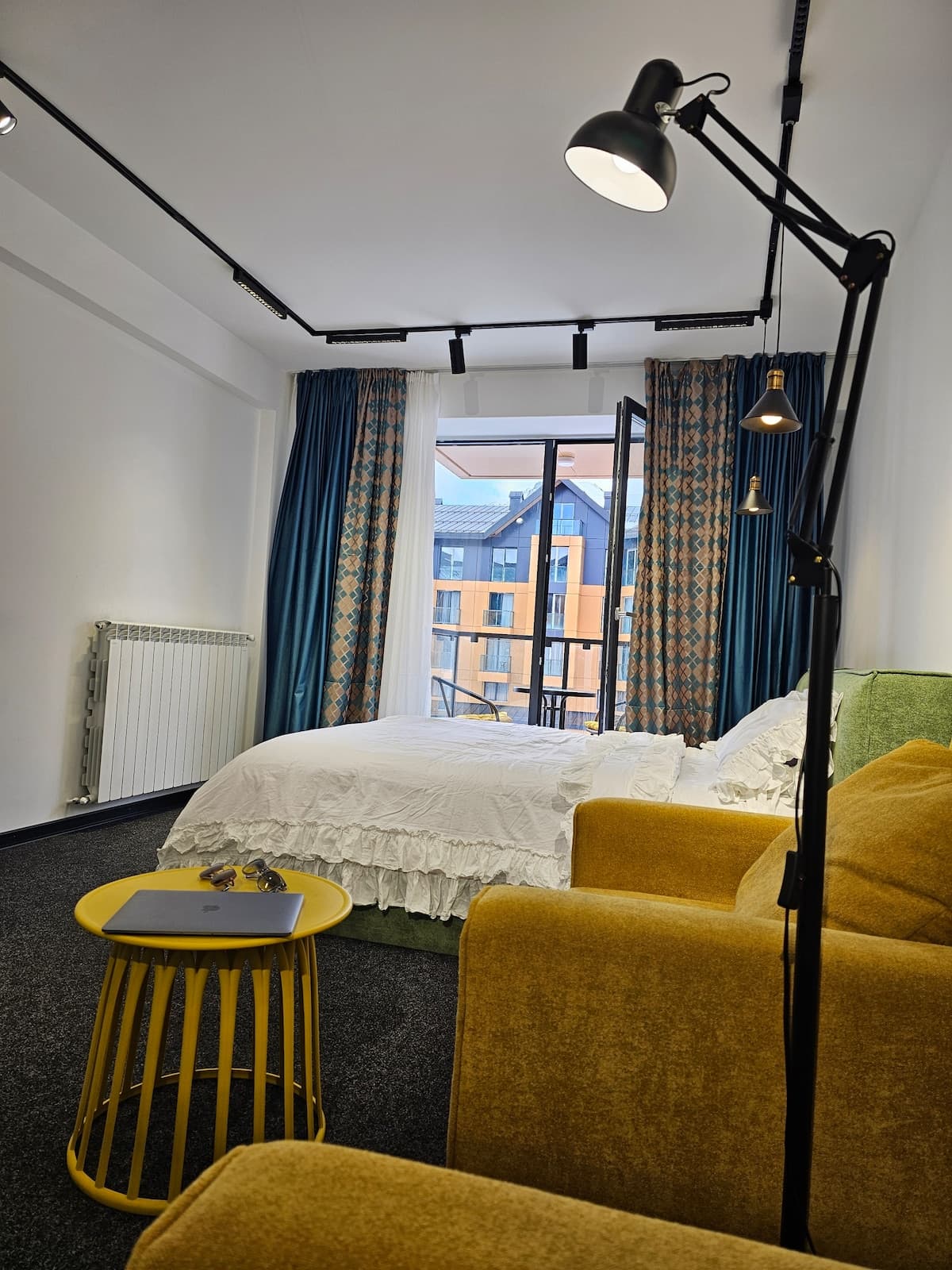 Bedroom with floor lamp and armchairs