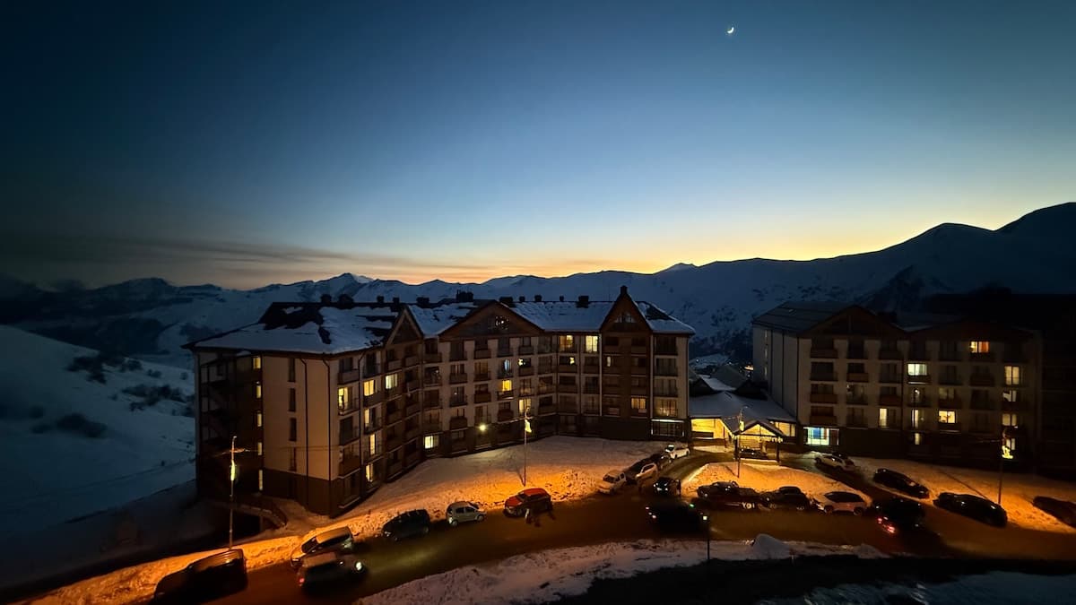 Gudauri village at sunset with mountains