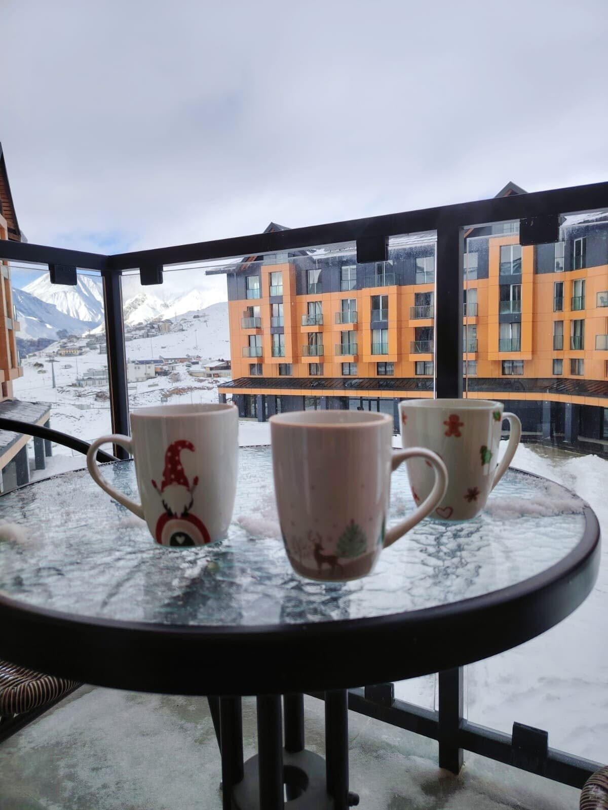 Coffee on the balcony with mountain panorama