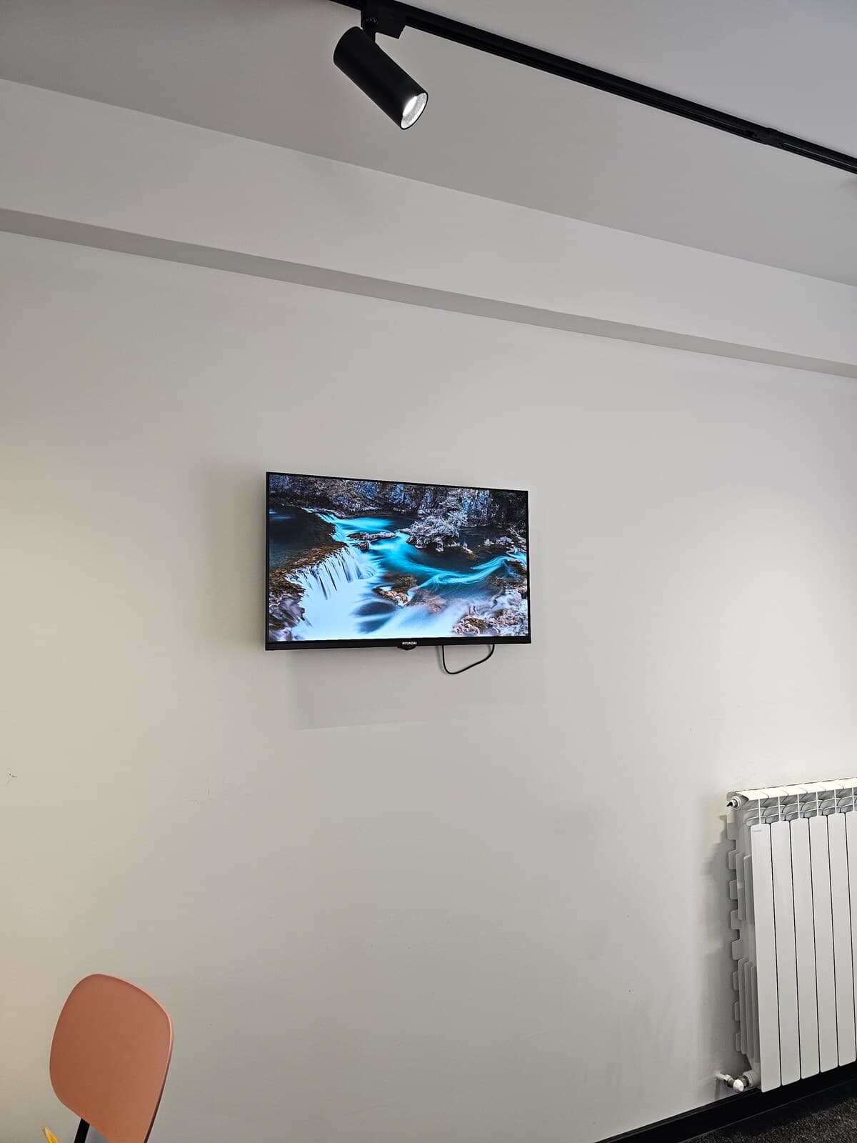 Wall-mounted Smart TV and heating